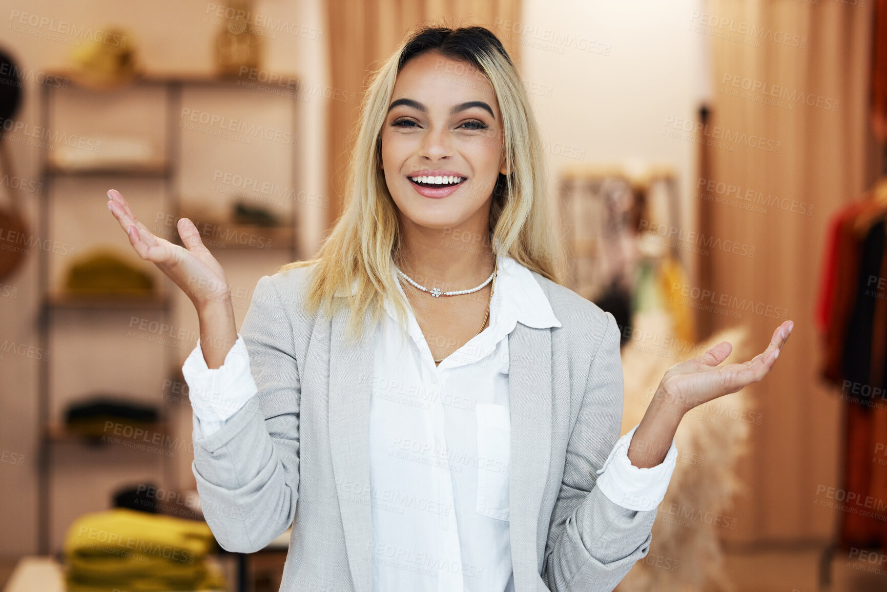 Buy stock photo Shot of a young businesswoman in her clothing store