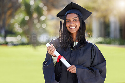 Buy stock photo Cropped portrait of an attractive young female student celebrating on graduation day