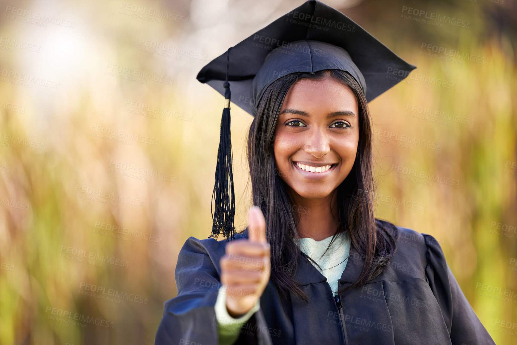 Buy stock photo Cropped portrait of an attractive young female student celebrating on graduation day