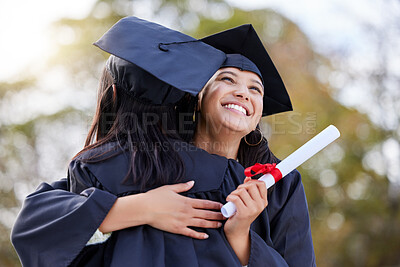 Buy stock photo Graduation, education and woman friends hugging at a university event on campus for celebration. Graduate, certificate and hug with female students together in support of a scholarship achievement