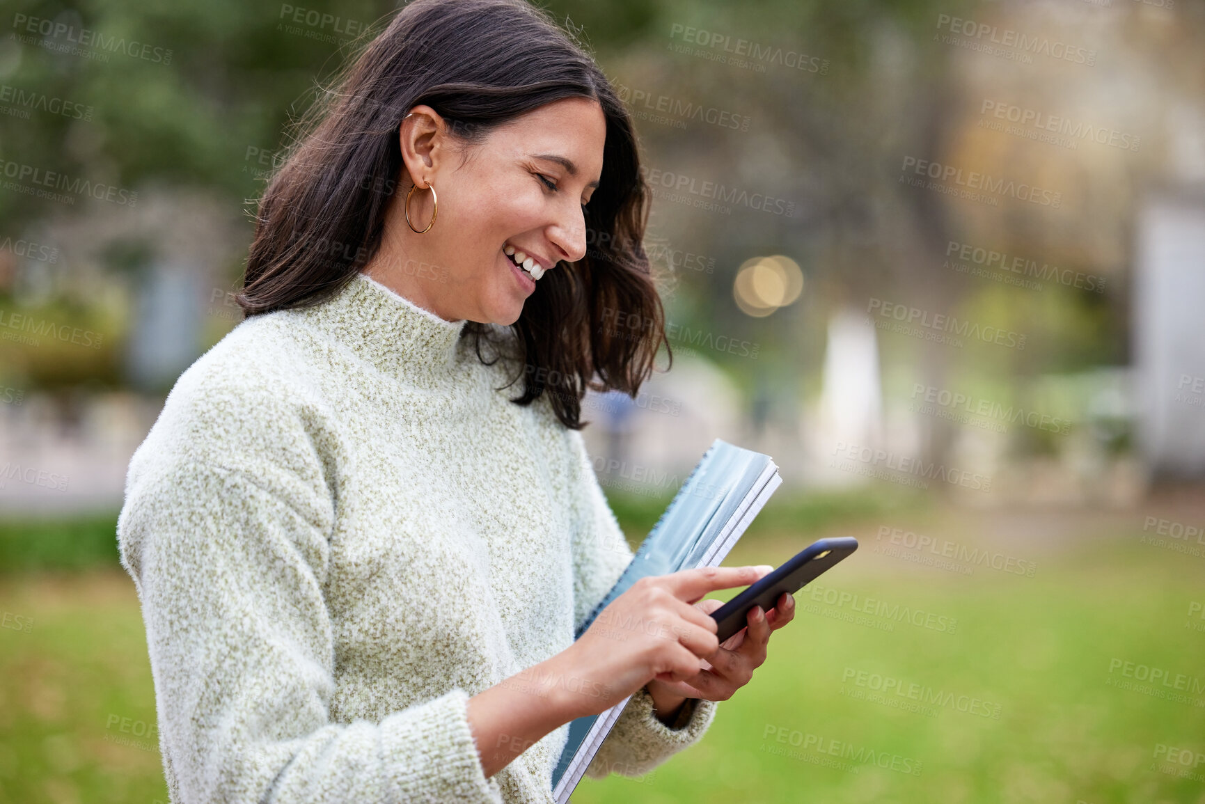 Buy stock photo Student, phone text and woman laugh in a park with learning, research and info on campus. Smile, mobile and university women with notes, social media and college test with a study break outdoor 