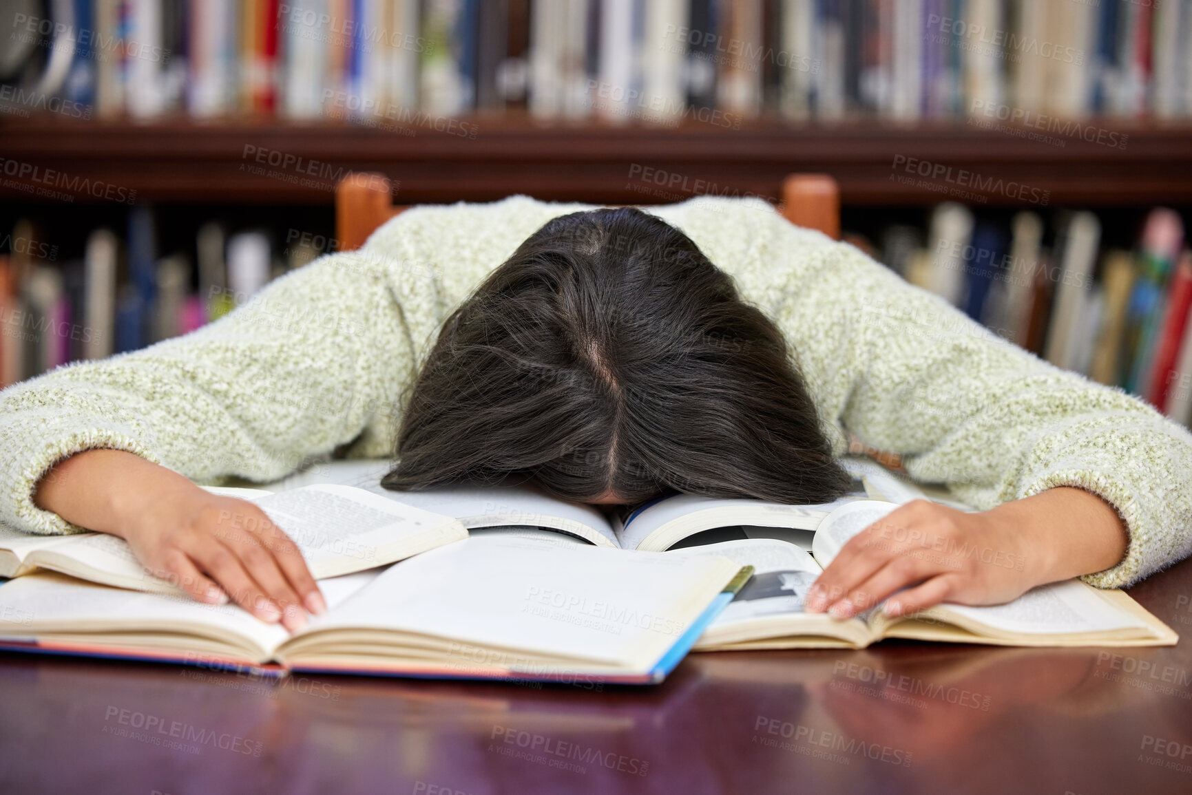 Buy stock photo Student, sleeping and library with woman, exam and course research burnout from project at school. University, nap and notes with learning, education and studying with deadline and fatigue on campus