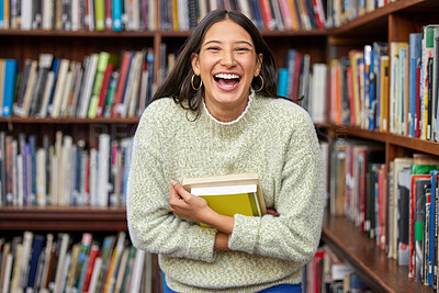 Buy stock photo Shot of a female standing in a library
