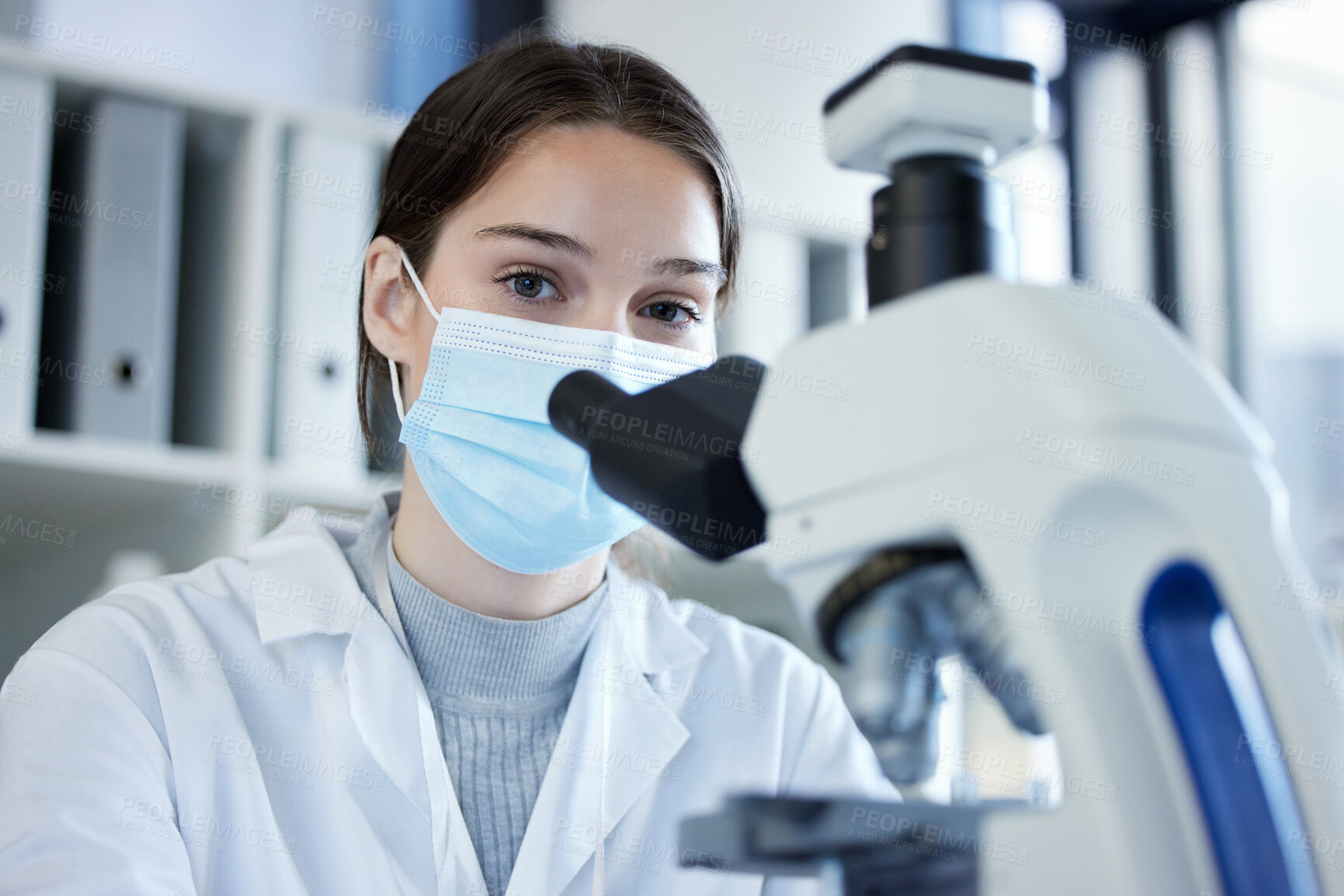 Buy stock photo Science, portrait and woman with microscope, mask and medical research in laboratory. Vaccine innovation, scientist or lab technician for healthcare, medicine and pharmaceutical development with ppe.