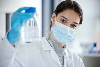 Buy stock photo Portrait of a young woman analysing a sample in a lab