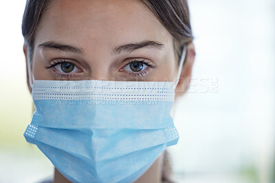 Buy stock photo Portrait of a young woman wearing a face mask in a lab