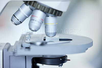 Buy stock photo Closeup shot of a microscope in an empty lab
