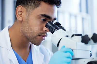 Buy stock photo Science, innovation and a man with microscope in a lab for medical research and analysis. Serious, medicine and a scientist doing a check of chemistry, microbiology or a virus working at a clinic