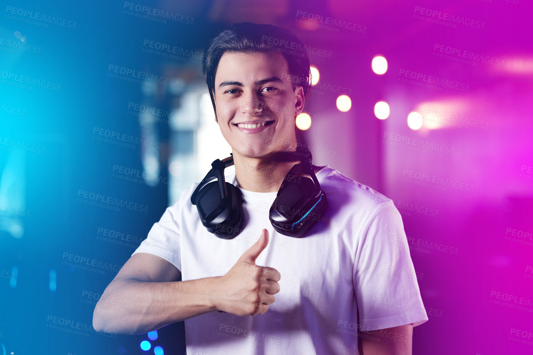 Buy stock photo Shot of a young man showing thumbs up while playing computer games