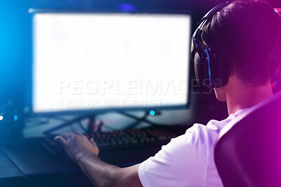 Buy stock photo Rearview shot of a man playing computer games