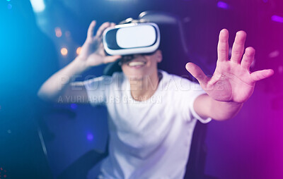 Buy stock photo Shot of a young man using 3d goggles while playing computer games