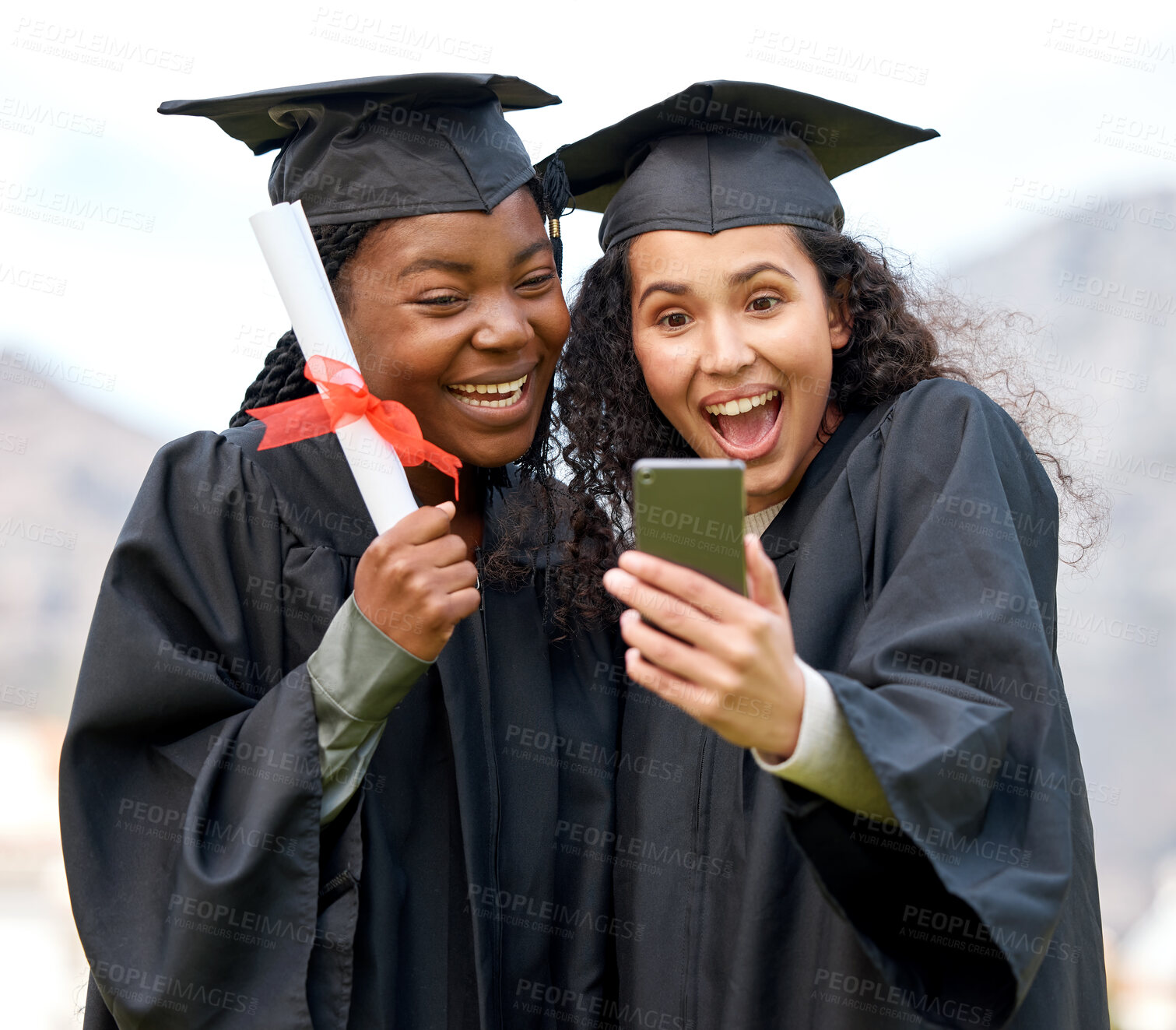 Buy stock photo Closeup shot of two young women taking selfies on graduation day