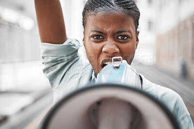 Buy stock photo Shot of a young female protesting in the city