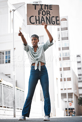 Buy stock photo Shot of a young woman protesting in the city