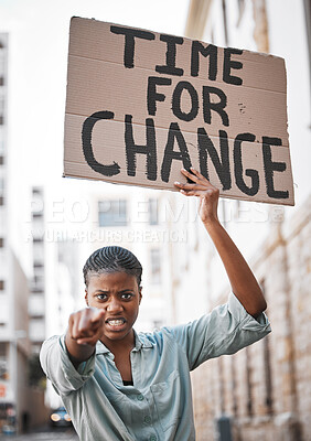 Buy stock photo Shot of a young woman protesting in the city
