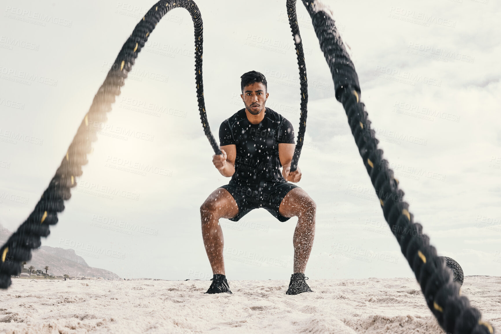 Buy stock photo Exercise, man and battle rope on beach for endurance challenge, strength or core training in outdoor. Fitness, sports and male athlete for muscle development, intense performance or full body workout