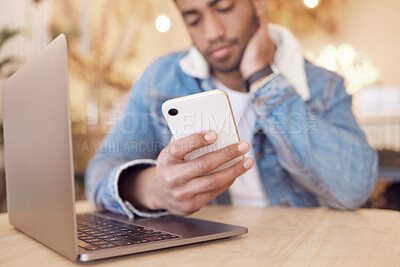 Buy stock photo Mobile phone, man and relax in cafe for social media, communication or networking. Online, app notification and hand of person with laptop for browsing internet, trending update or reading post