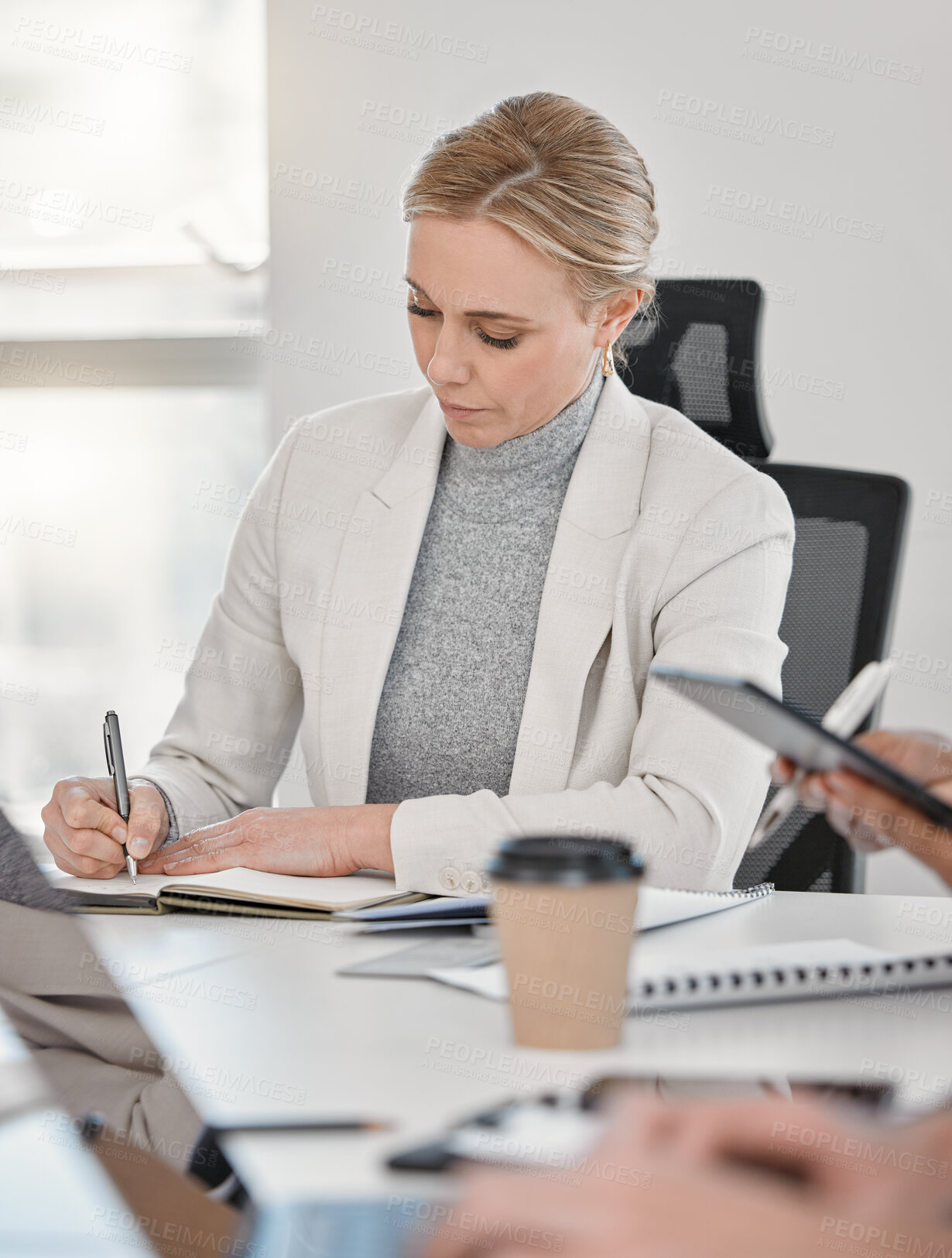 Buy stock photo Business woman, writing on notebook and laptop on table with employee, calendar schedule and planning in office. Personal assistant, event planner and person taking notes, meeting agenda and idea