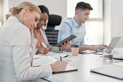 Buy stock photo Shot of a group of colleagues having a discussion in a office