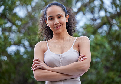 Buy stock photo Girl, portrait and confident in nature for travel, trees and smile in park for weekend trip. Female person, arms crossed and proud of peace or calm in garden, vacation and relax by plants in outdoor