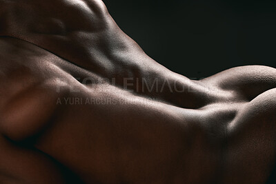 Buy stock photo Shot of a muscular man posing against a studio background