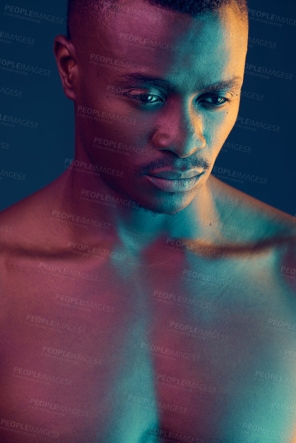 Buy stock photo Shot of a muscular young man posing against a studio background