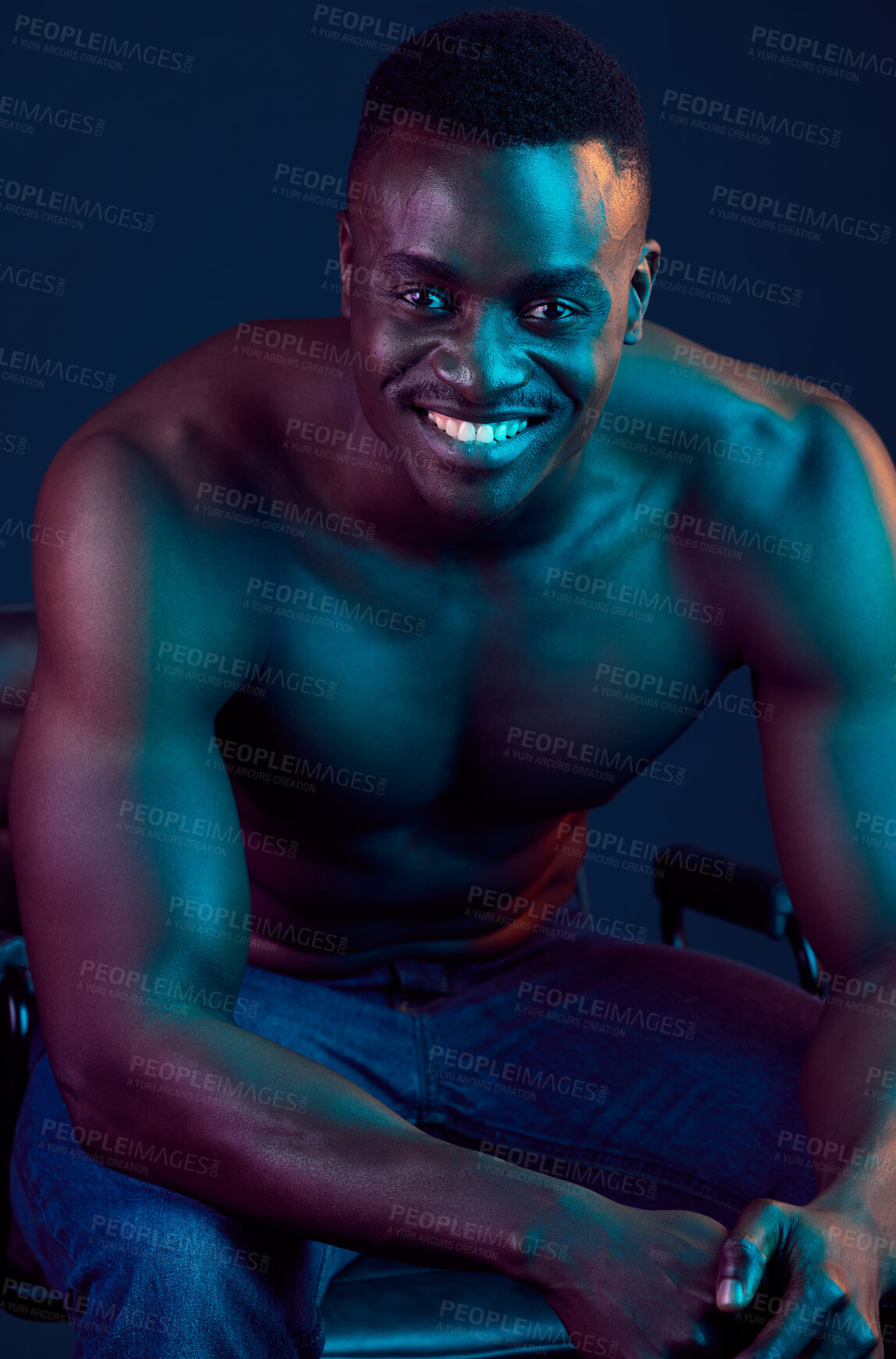 Buy stock photo Shot of a muscular young man posing against a studio background