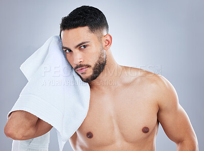 Buy stock photo Man, towel and cleaning face in studio portrait for health, shine and hygiene by background. Person, model and cloth for skincare, wellness and natural glow with beauty, cosmetics and transformation