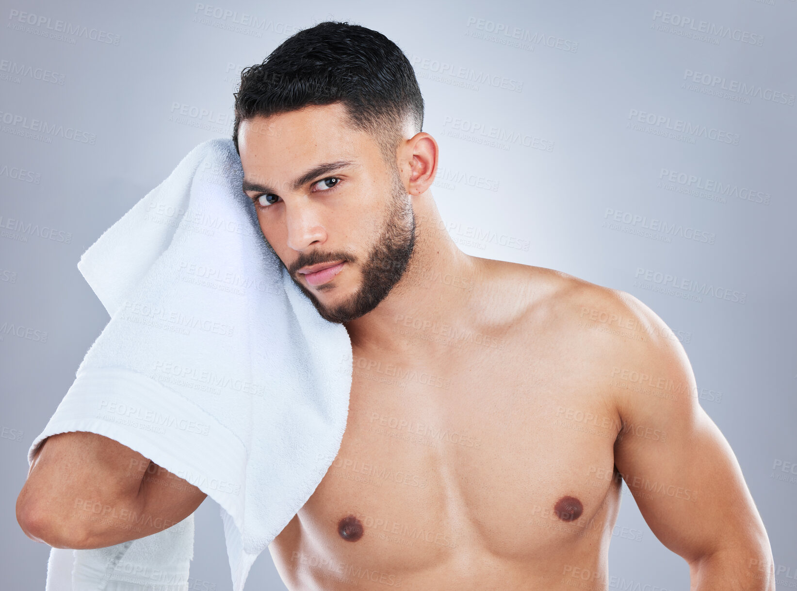 Buy stock photo Man, towel and cleaning face in studio portrait for health, shine and hygiene by background. Person, model and cloth for skincare, wellness and natural glow with beauty, cosmetics and transformation