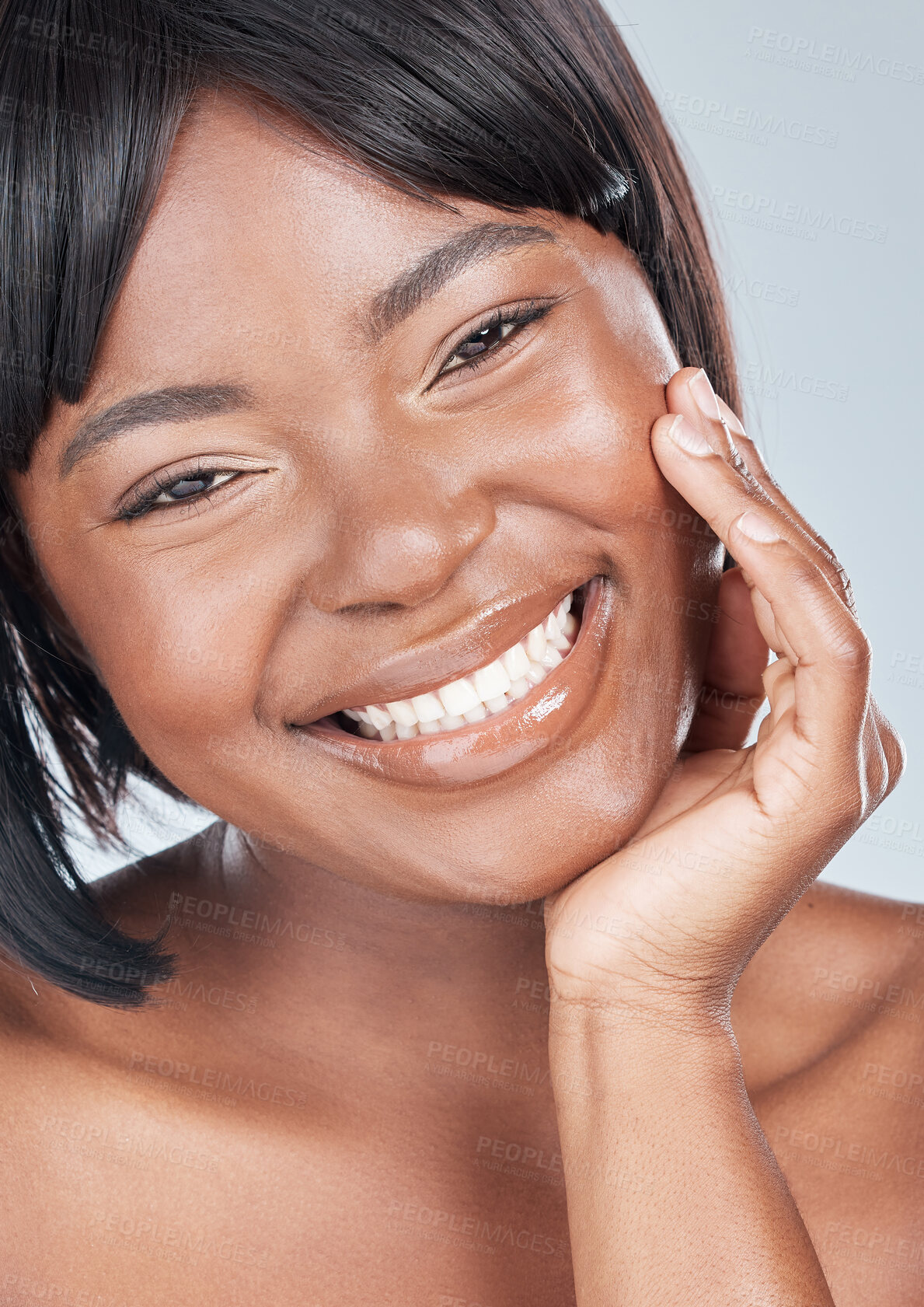 Buy stock photo Black woman, portrait and happy face with skincare, cosmetics or makeup on a gray studio background. Closeup of African, female person or young model for facial treatment, dermatology or cosmetology