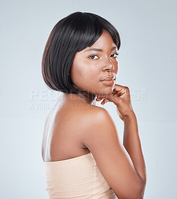 Buy stock photo Studio shot of an attractive young woman posing against a grey background