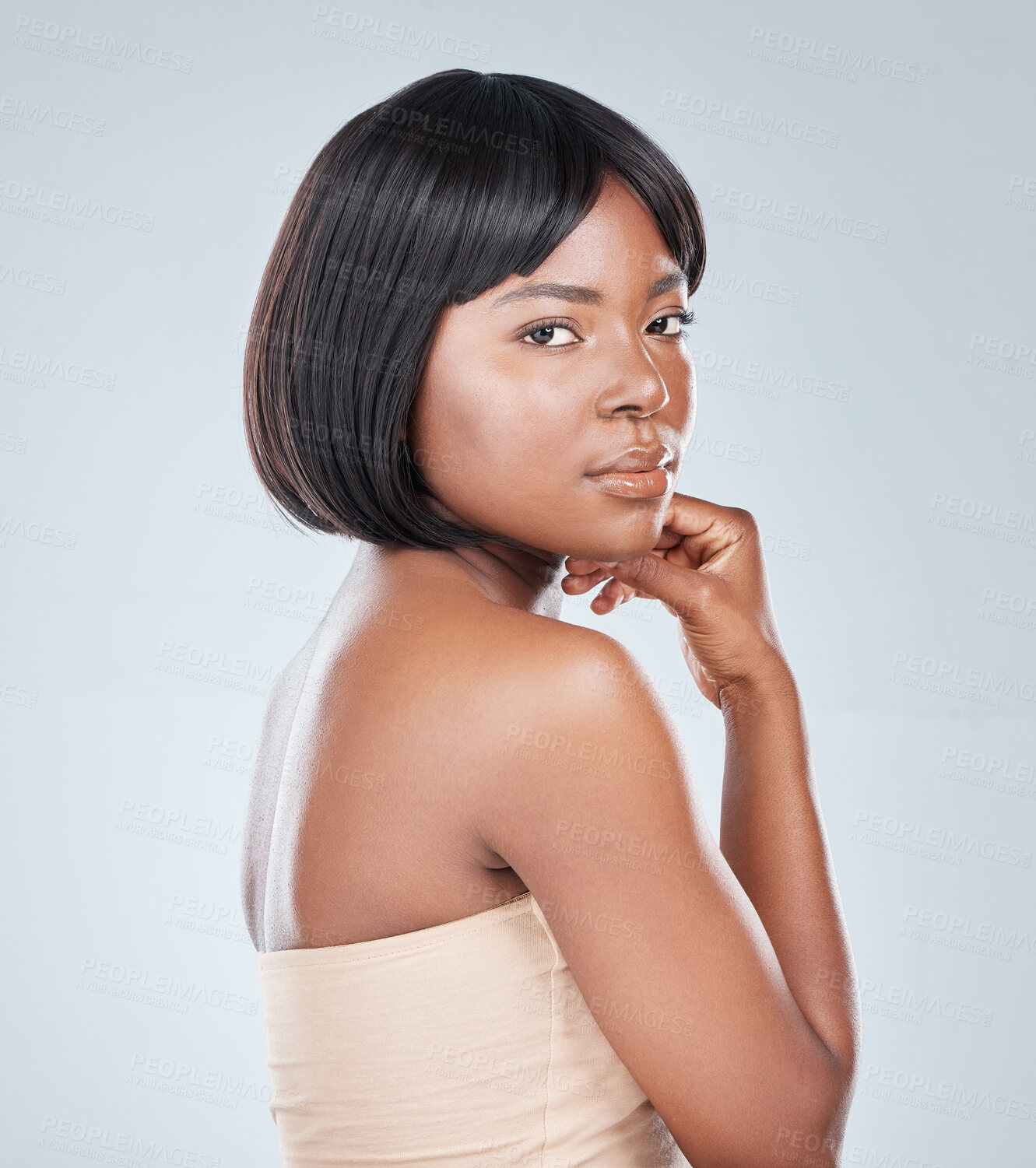 Buy stock photo Studio shot of an attractive young woman posing against a grey background