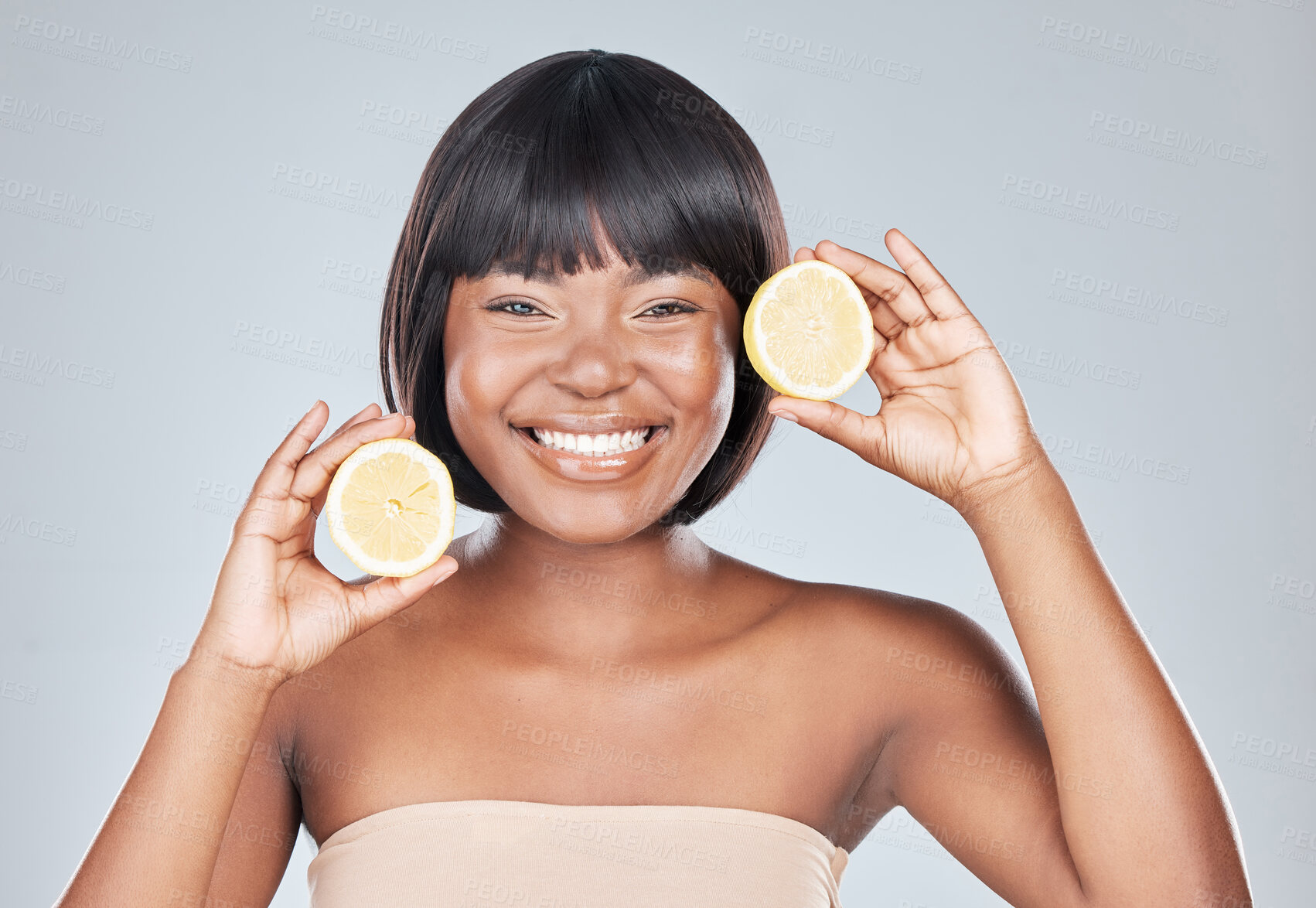 Buy stock photo Skincare, portrait and black woman in studio with lemon for wellness, shine or dermatology treatment on grey background. Face, smile or happy girl model with fruit for citrus, benefits or skin detox