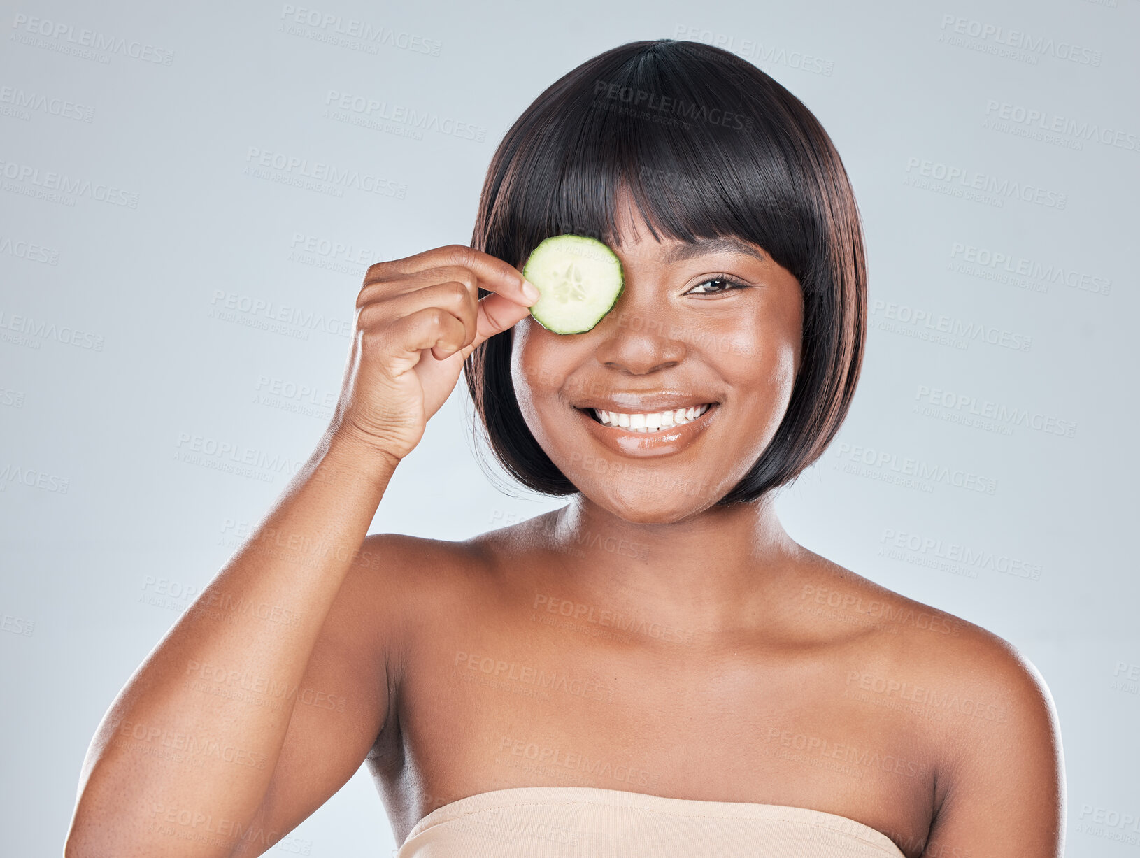 Buy stock photo Skincare, portrait and happy black woman with cucumber In studio for wellness, shine or dermatology on grey background. Organic, face and girl model with eco friendly, sustainable or vegan beauty