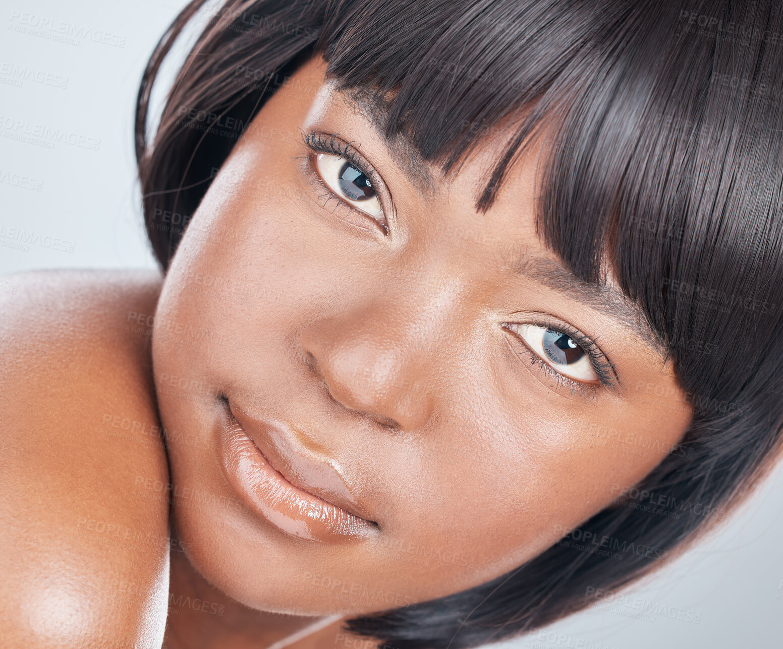 Buy stock photo Studio shot of an attractive young woman posing against a grey background