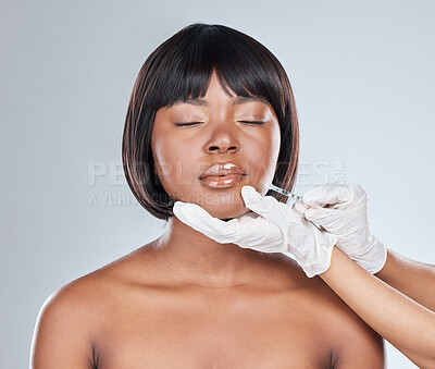 Buy stock photo Hands, woman and injection for lip filler in studio for plastic surgery, beauty or change by background. African girl, doctor and chemical for cosmetics, syringe and liquid product for transformation