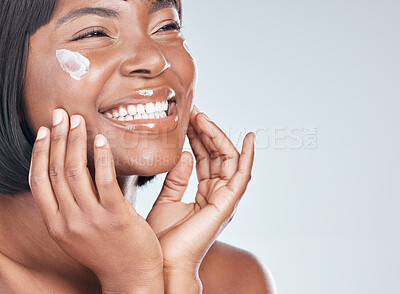 Buy stock photo Happy black woman, skincare and facial with cream for beauty or moisturizer on a white studio background. Face of African, female person or model with smile for lotion, cosmetics or healthy skin