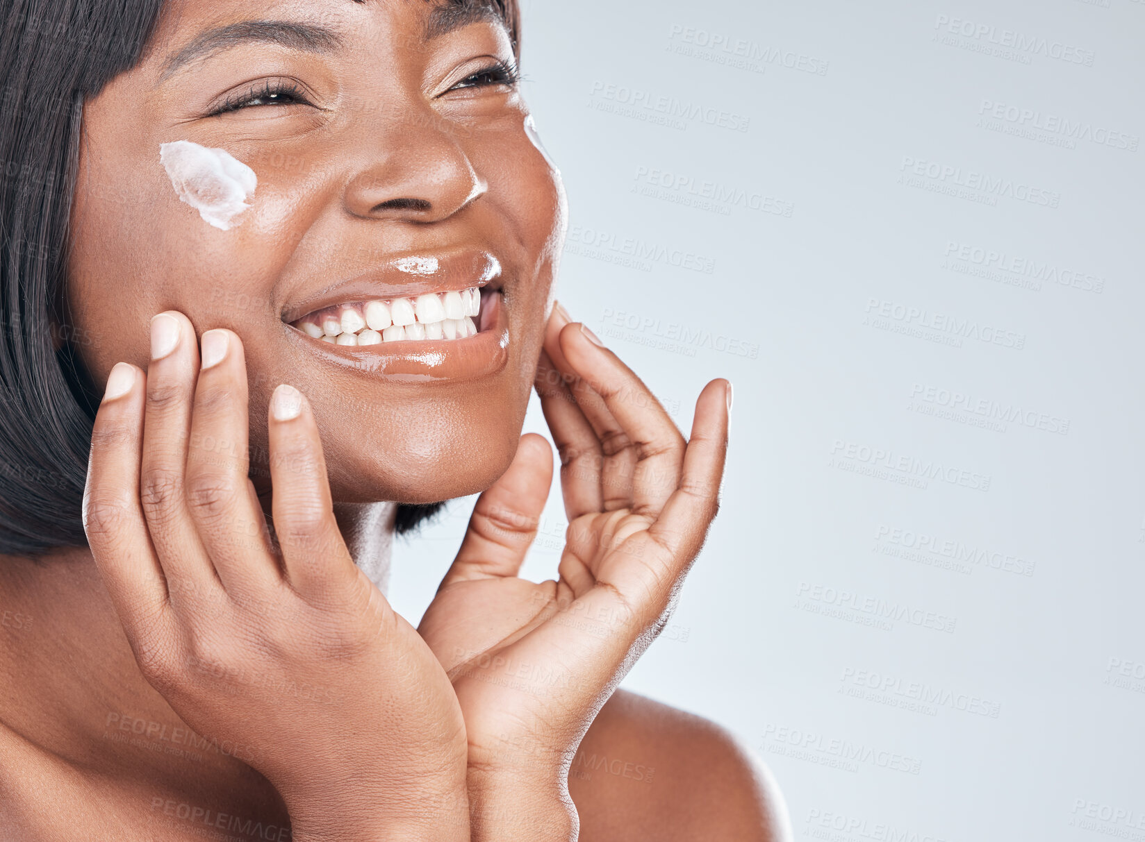 Buy stock photo Happy black woman, skincare and facial with cream for beauty or moisturizer on a white studio background. Face of African, female person or model with smile for lotion, cosmetics or healthy skin