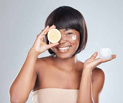 Buy stock photo Happy, portrait and black woman with lemon and container for skincare, cream or moisturizer on a white studio background. African, female person or model with smile for vitamin C, facial or collagen
