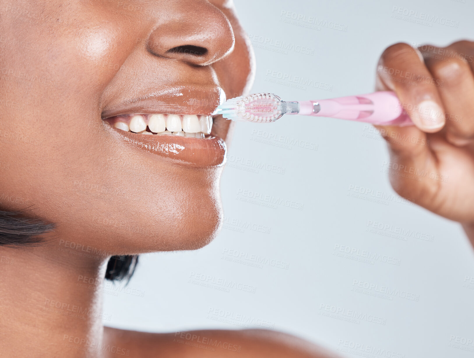 Buy stock photo Black woman, closeup and mouth with toothbrush for dental hygiene on a white studio background. Young African, female person or model with smile in satisfaction for oral, gum care or morning routine