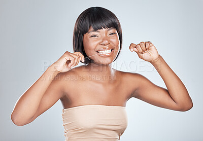 Buy stock photo Happy, portrait and black woman with dental floss for clean teeth on a white studio background. Young female person or African model with smile for tooth whitening, cavity or oral, mouth or gum care