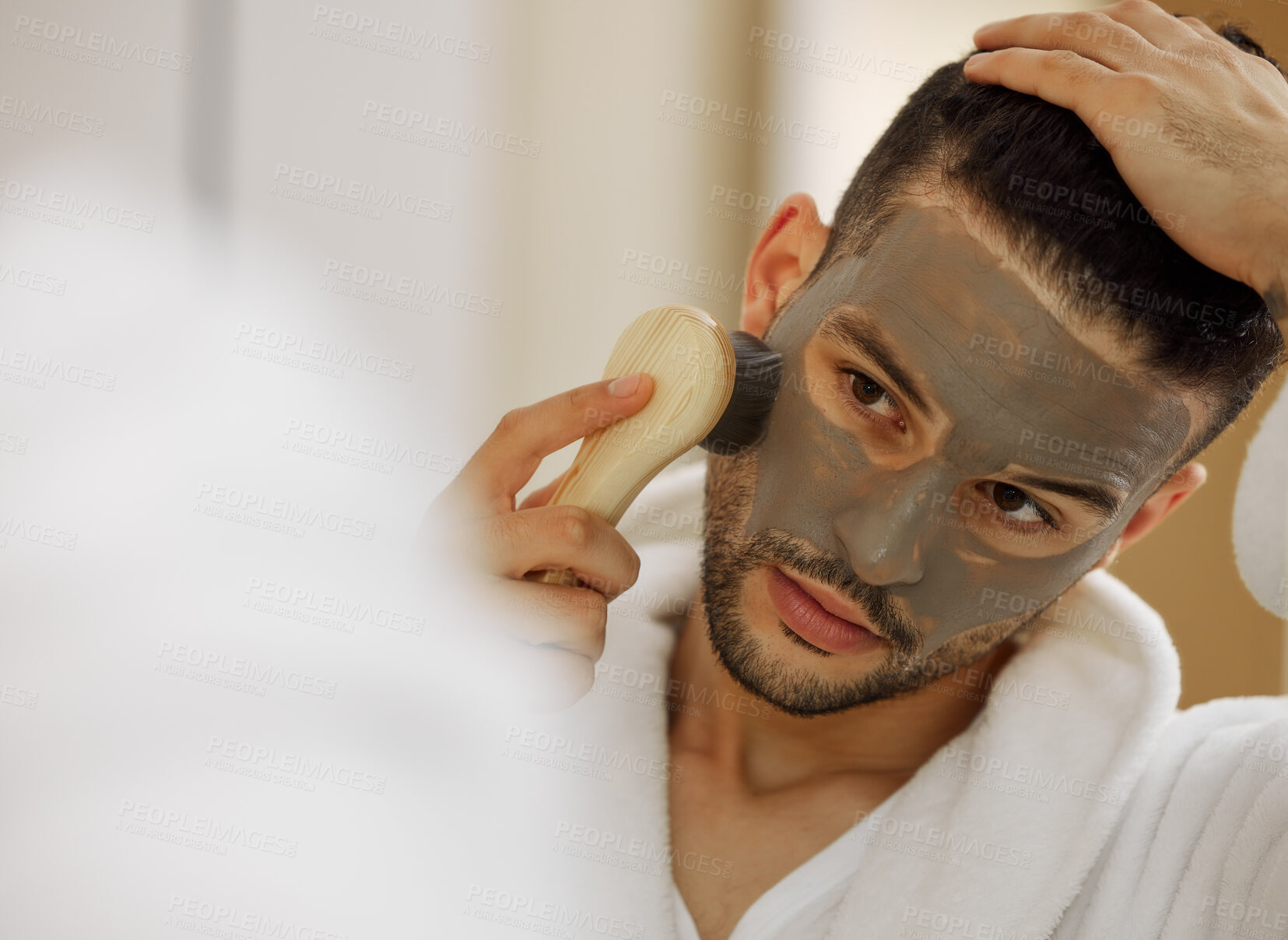 Buy stock photo Skincare, face mask and man in home with mirror for vegan beauty, skin glow and dermatology. Brush, facial product and male person in house for acne with self care and cosmetics with hyaluronic acid