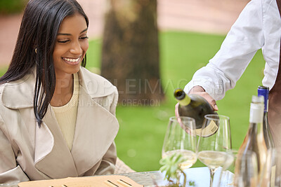Buy stock photo Shot of an attractive young woman sitting and enjoying a wine tasting