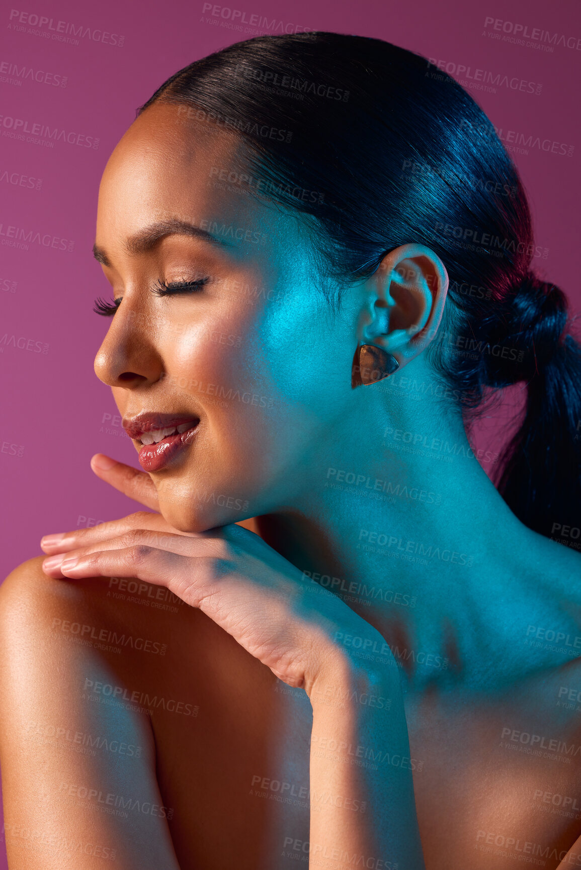 Buy stock photo Cropped shot of an attractive young woman posing in studio against a pink background