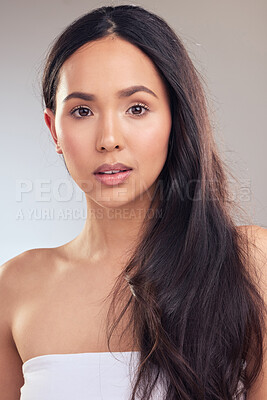 Buy stock photo Shot of an attractive young woman posing alone in the studio