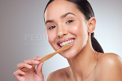 Buy stock photo Portrait, smile and toothbrush with oral hygiene woman in studio on gray background for dental care. Face, mouth and happy person brushing teeth in bathroom to prevent cavity, decay or gum disease