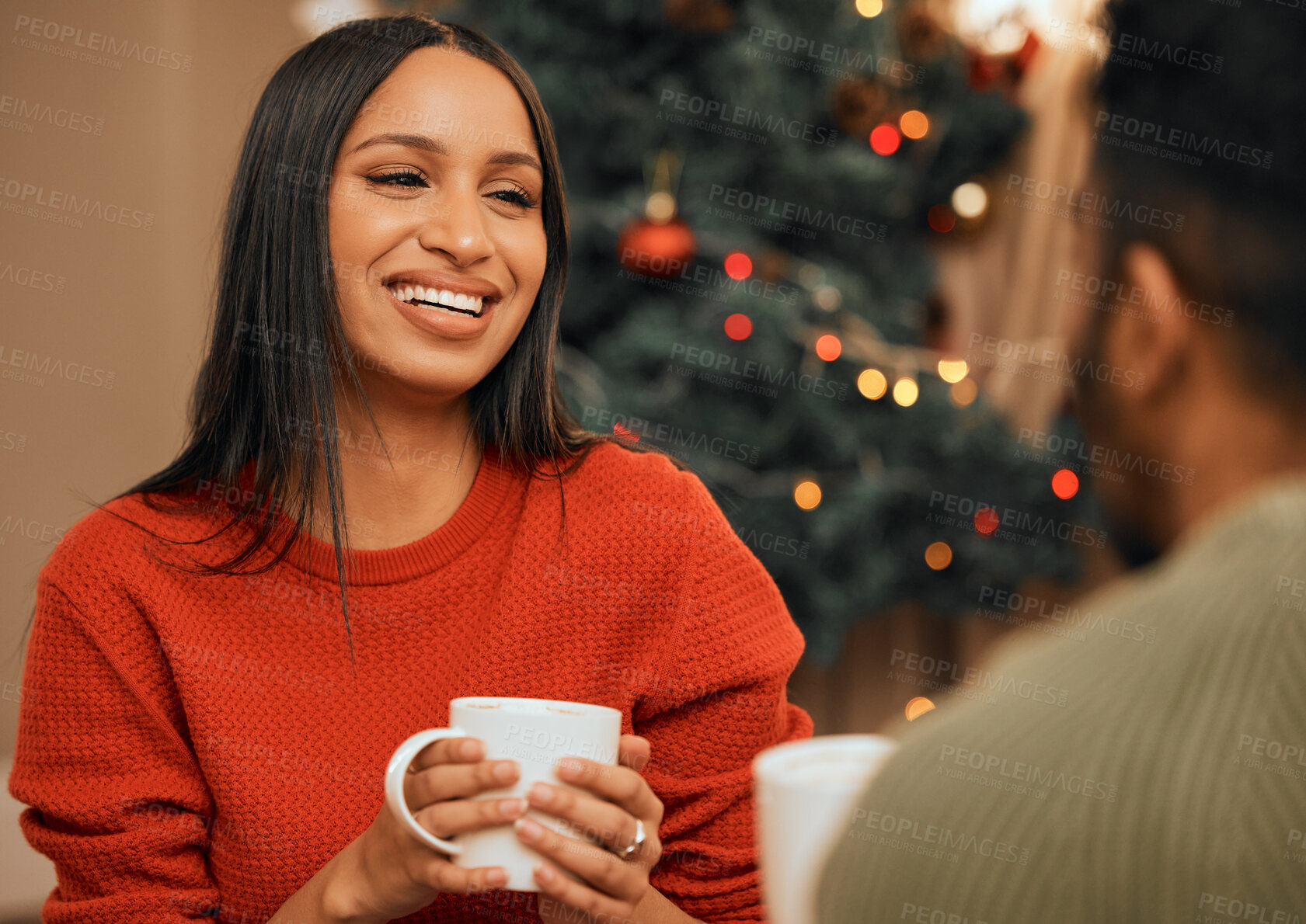 Buy stock photo Happy, couple and christmas celebration with morning coffee to relax, bonding and fun on festive holiday at home. People, smile and xmas tree with drink in lounge to enjoy winter season together