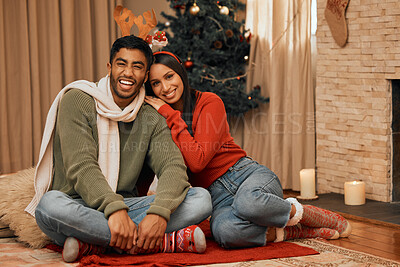 Buy stock photo Portrait, couple and Christmas with embrace for celebration of gift at house, romantic and bonding on holiday in winter. Happy, woman and man with love, surprise and party event for relationship