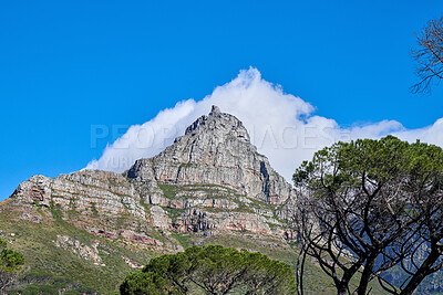 Buy stock photo Landscape view, mountains and blue sky of Table Mountain with copy space, clouds and trees in an environmental nature reserve. Scenery of famous landmark and remote hiking countryside in South Africa