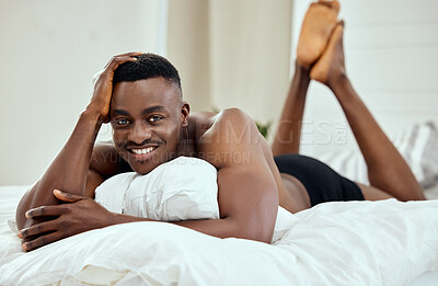 Buy stock photo Happy, smile and portrait of black man in bedroom for relax, confident and comfortable. Happiness, calm and weekend with male person in bed at home for free time, morning routine and wake up